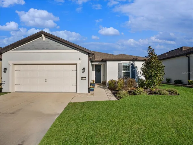 a view of a studio with wooden floor