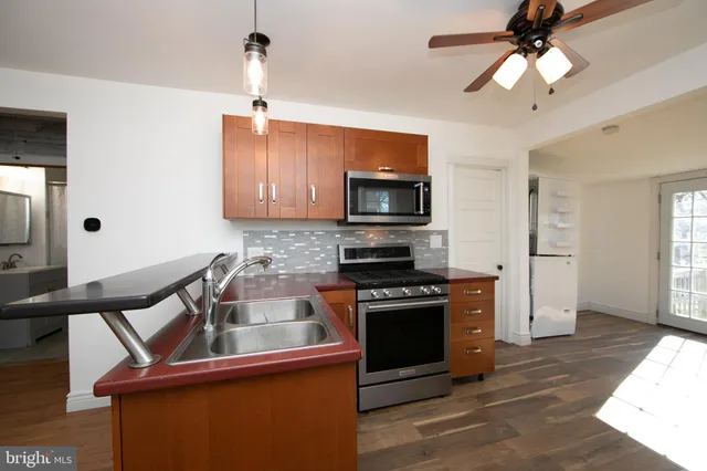 a kitchen with a stove and a microwave