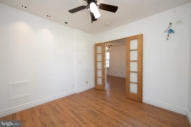 a bathroom with a tub a sink and mirror