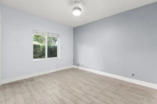 a bathroom with a sink vanity and mirror