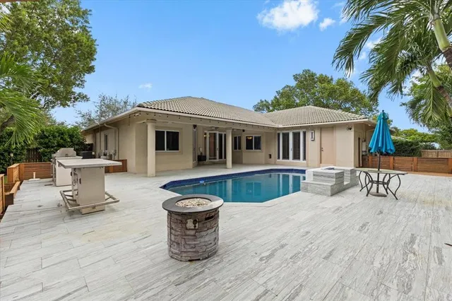 a view of a swimming pool with a patio