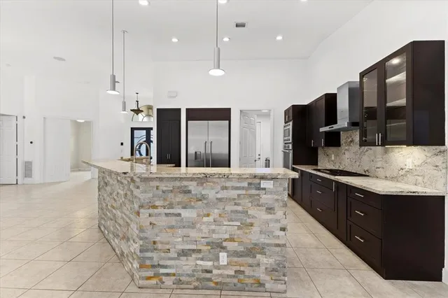 a large bathroom with a large tub and sink