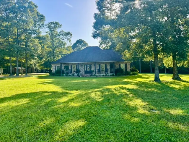 a view of a house with a big yard