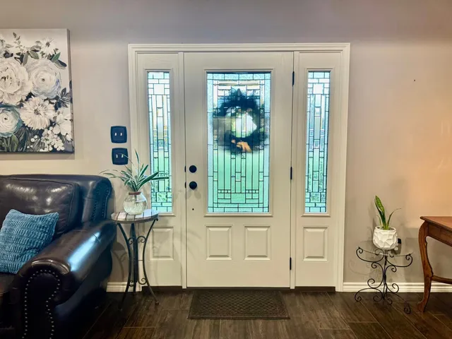 a view of a livingroom with furniture and windows