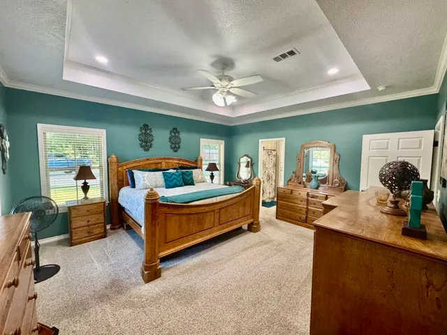 a bed room with furniture and a chandelier
