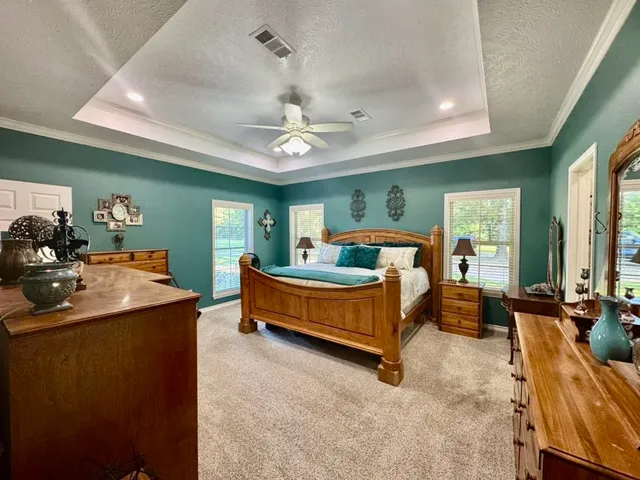 a bed room with a bed and furniture