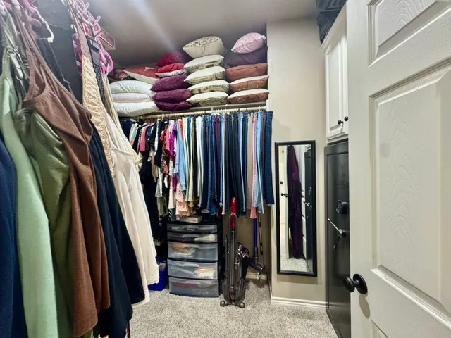 a bathroom with a sink a mirror a vanity and a shower