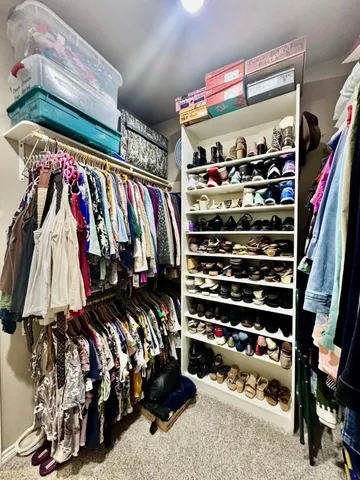 a view of a hallway with a refrigerator