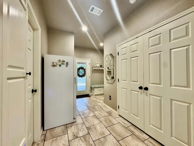 a view of a livingroom with furniture and stairs