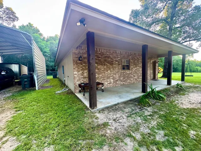 a kitchen with stainless steel appliances granite countertop a sink and a refrigerator