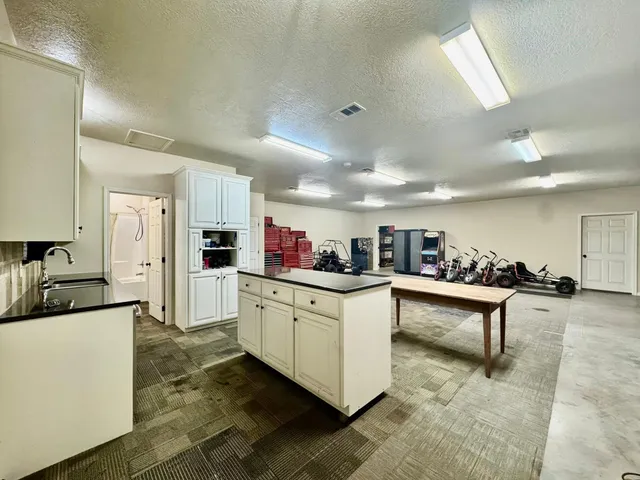 a bedroom with furniture and a air conditioner vent