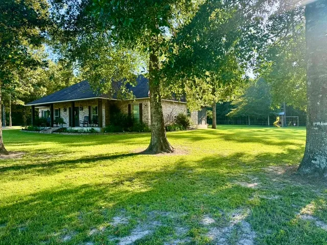 a view of a house with a big yard