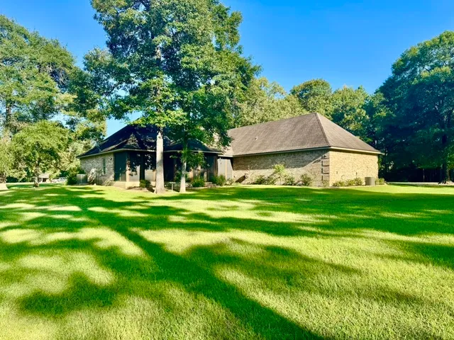 a aerial view of a house with a yard