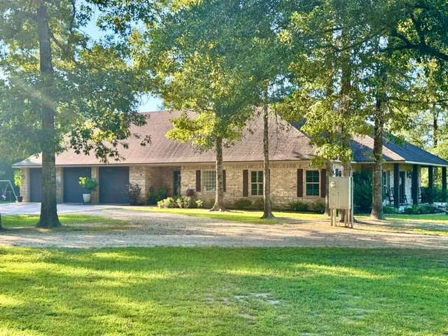 a house with trees in the background