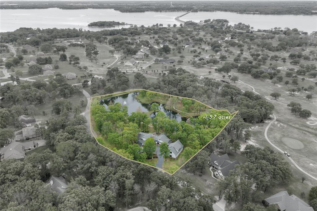 692 Private Road 5937 Emory, TX 75440 - Photo 2 of 40 an aerial view of a house with a yard and greenery