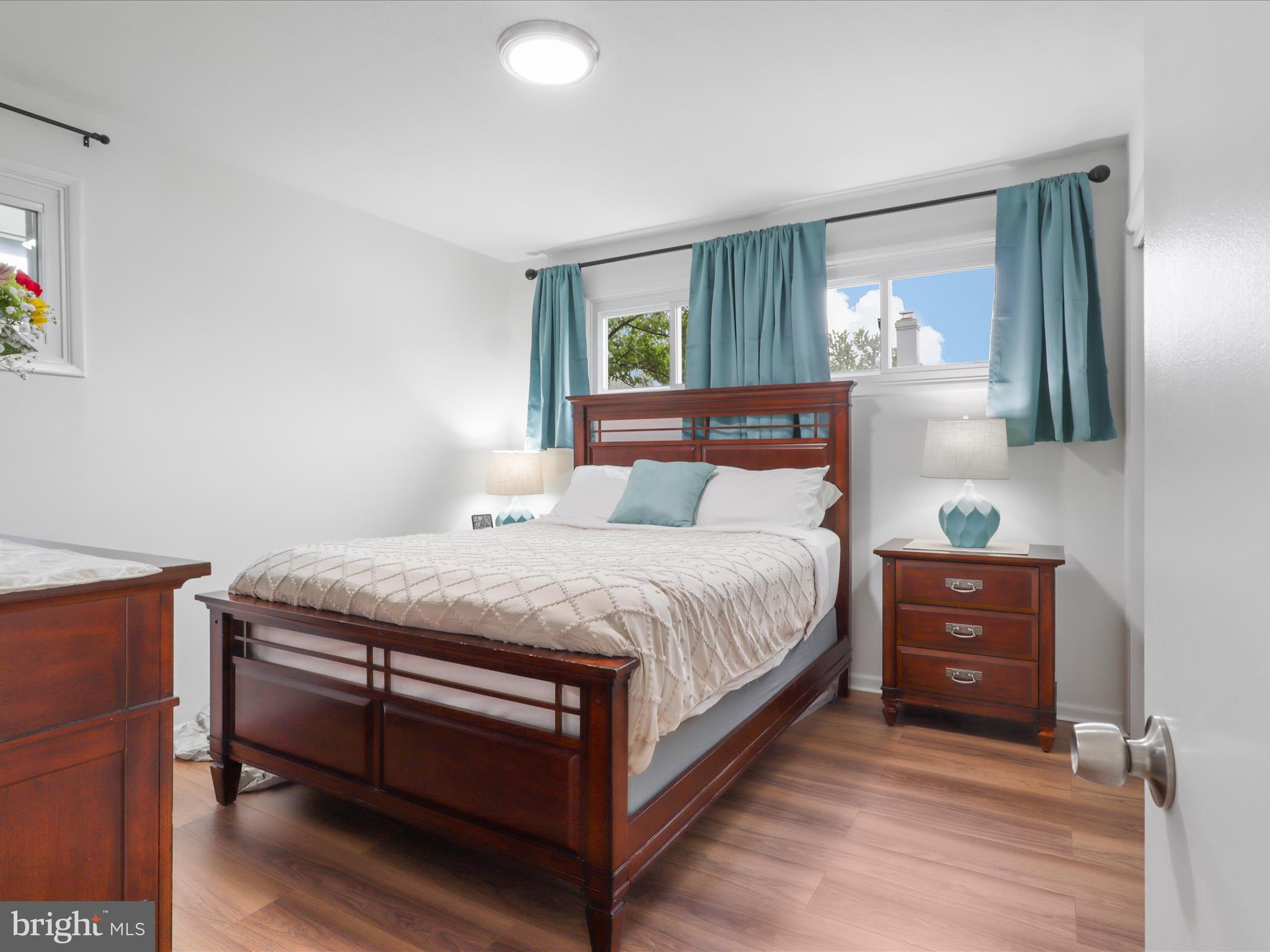 5902 Amelia Street Springfield, VA 22150 - Photo 10 of 15 a bedroom with a bed and a dresser
