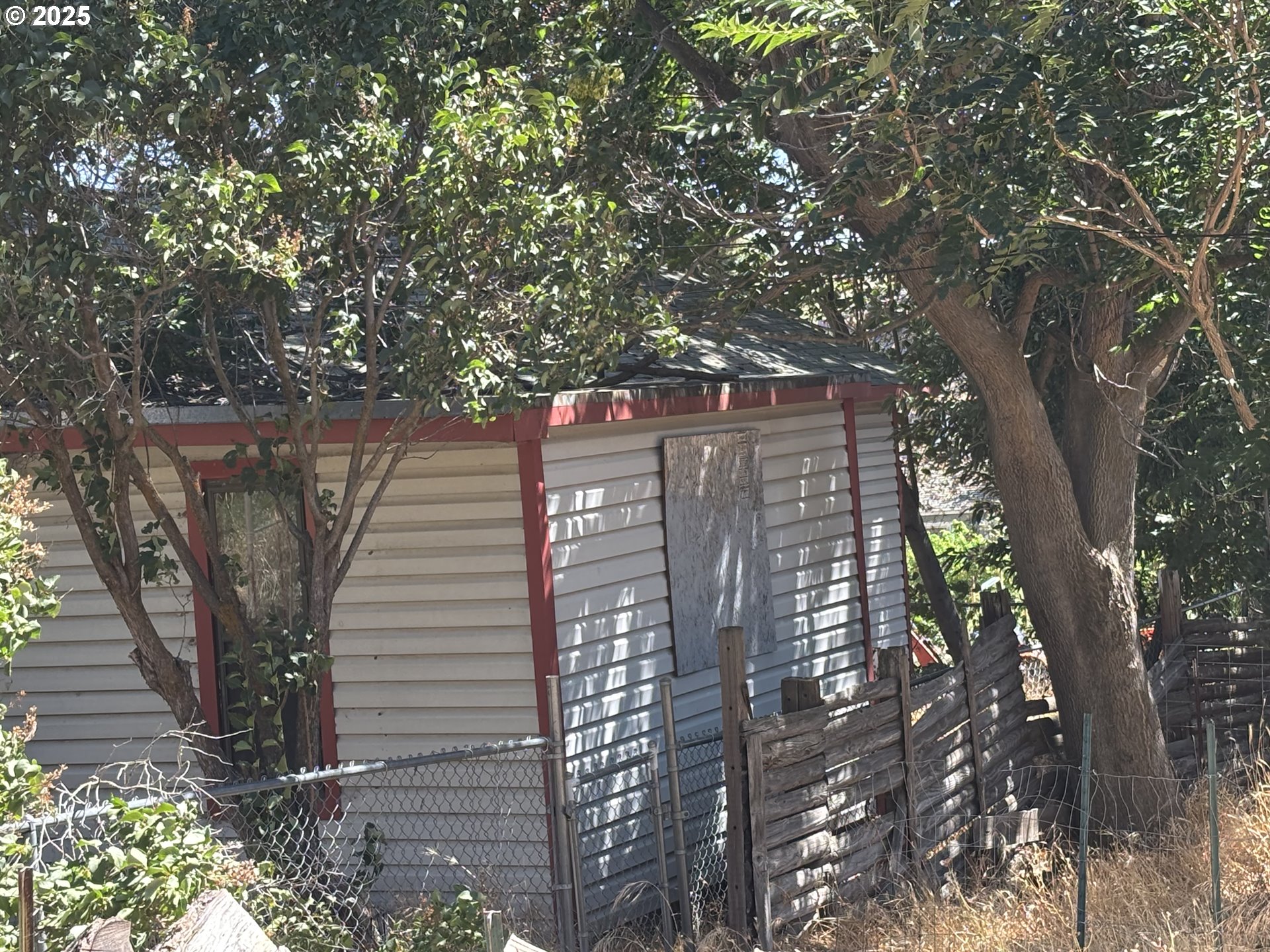 142 Bunn Street Wishram, WA 98673 - Photo 2 of 13 a view of a wooden balcony and trees