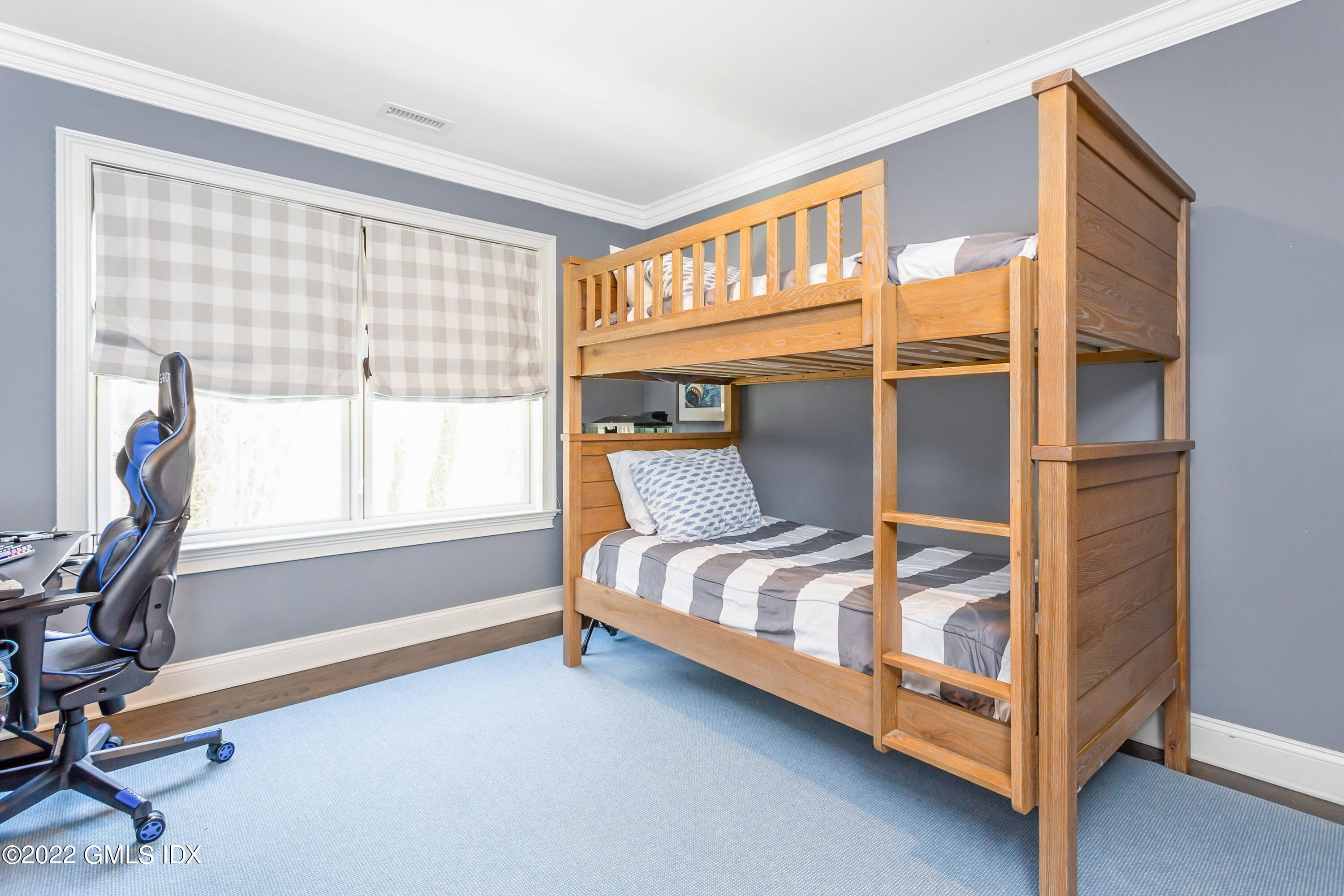 15 Dialstone Lane Riverside, CT 06878 - Photo 20 of 33 a bedroom with a bed chair and a window
