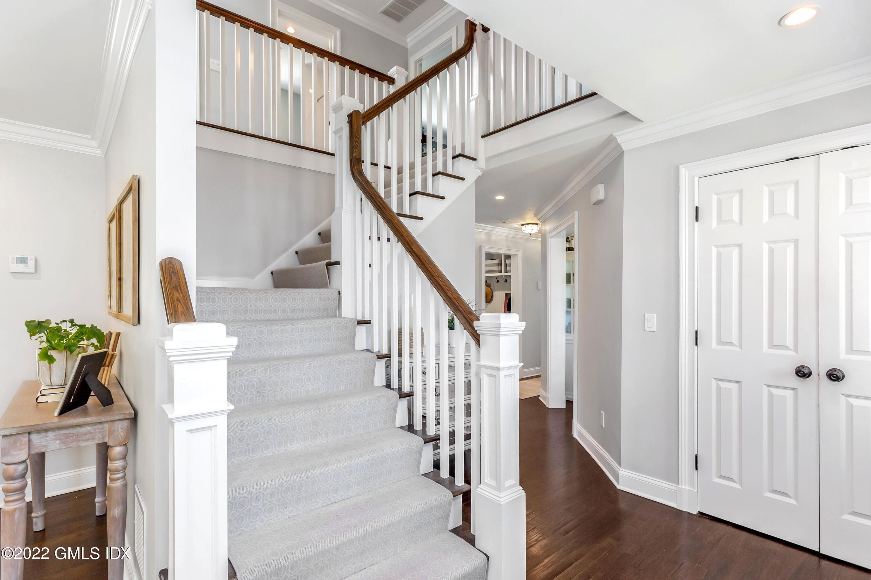 15 Dialstone Lane Riverside, CT 06878 - Photo 3 of 33 a view of entryway and hall with wooden floor