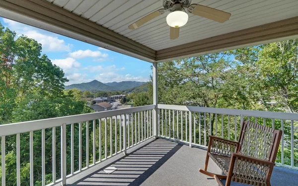 a view of a balcony with furniture