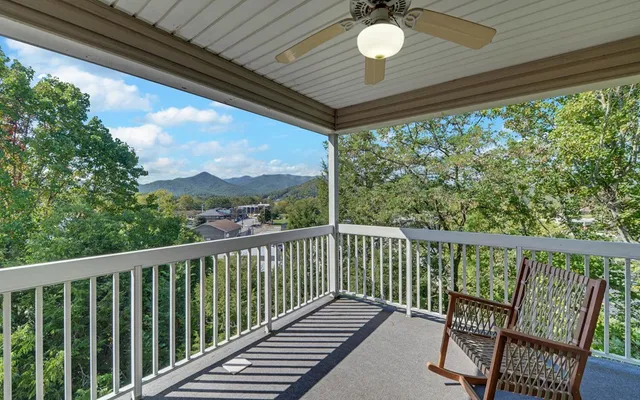 a view of a balcony with furniture