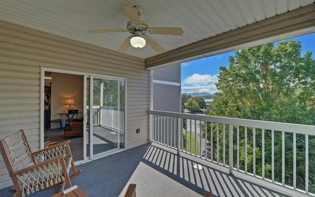 a view of a balcony with chairs