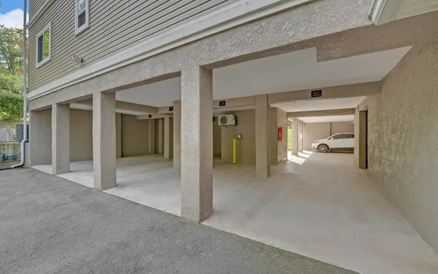 front view of a house with a glass door and a yard