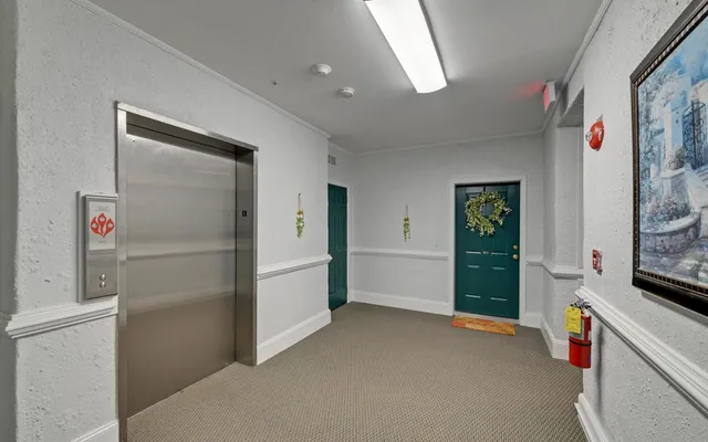 a kitchen with refrigerator and window