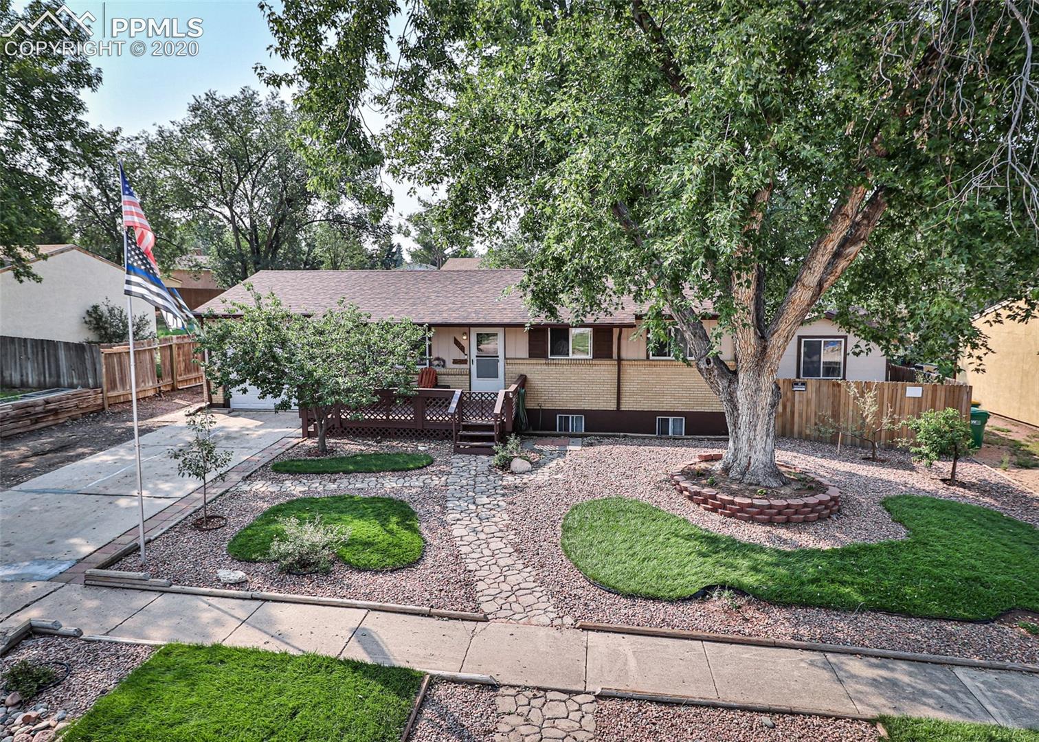 6727 Seneca Road Colorado Springs, CO 80915 - Photo 1 of 50 Beautifully landscaped front yard in Cimmaron Hills!