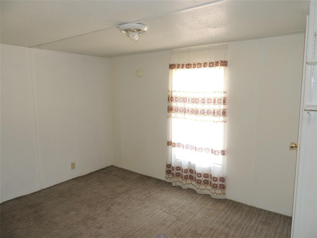 10231 Northeast 87 Place Bronson, FL 32621 - Photo 12 of 17 a view of an empty room and a window