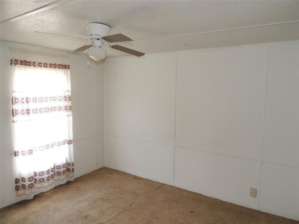 10231 Northeast 87 Place Bronson, FL 32621 - Photo 14 of 17 an empty room with a window