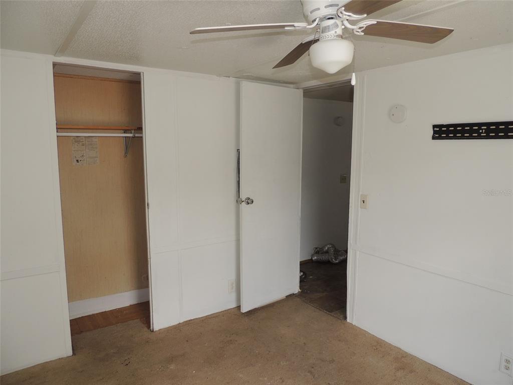 10231 Northeast 87 Place Bronson, FL 32621 - Photo 15 of 17 a view of a room with a fan and a fan