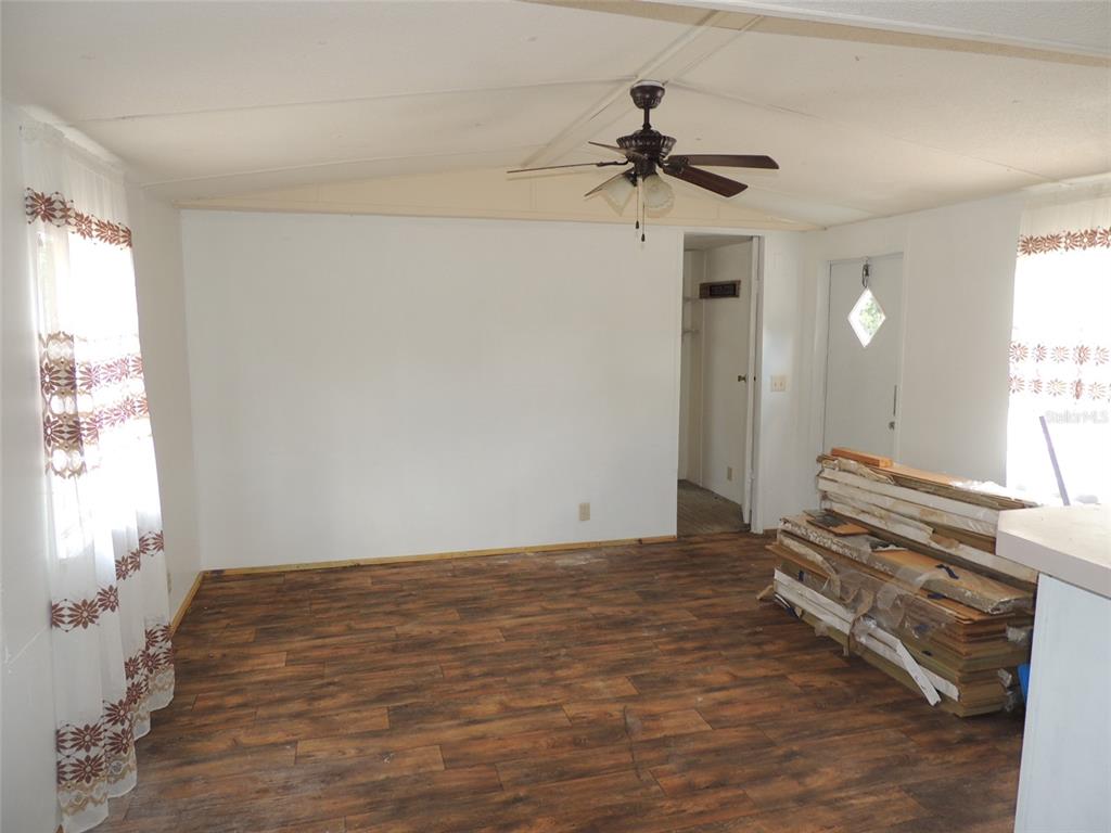 10231 Northeast 87 Place Bronson, FL 32621 - Photo 8 of 17 a view of a room with a flat screen tv