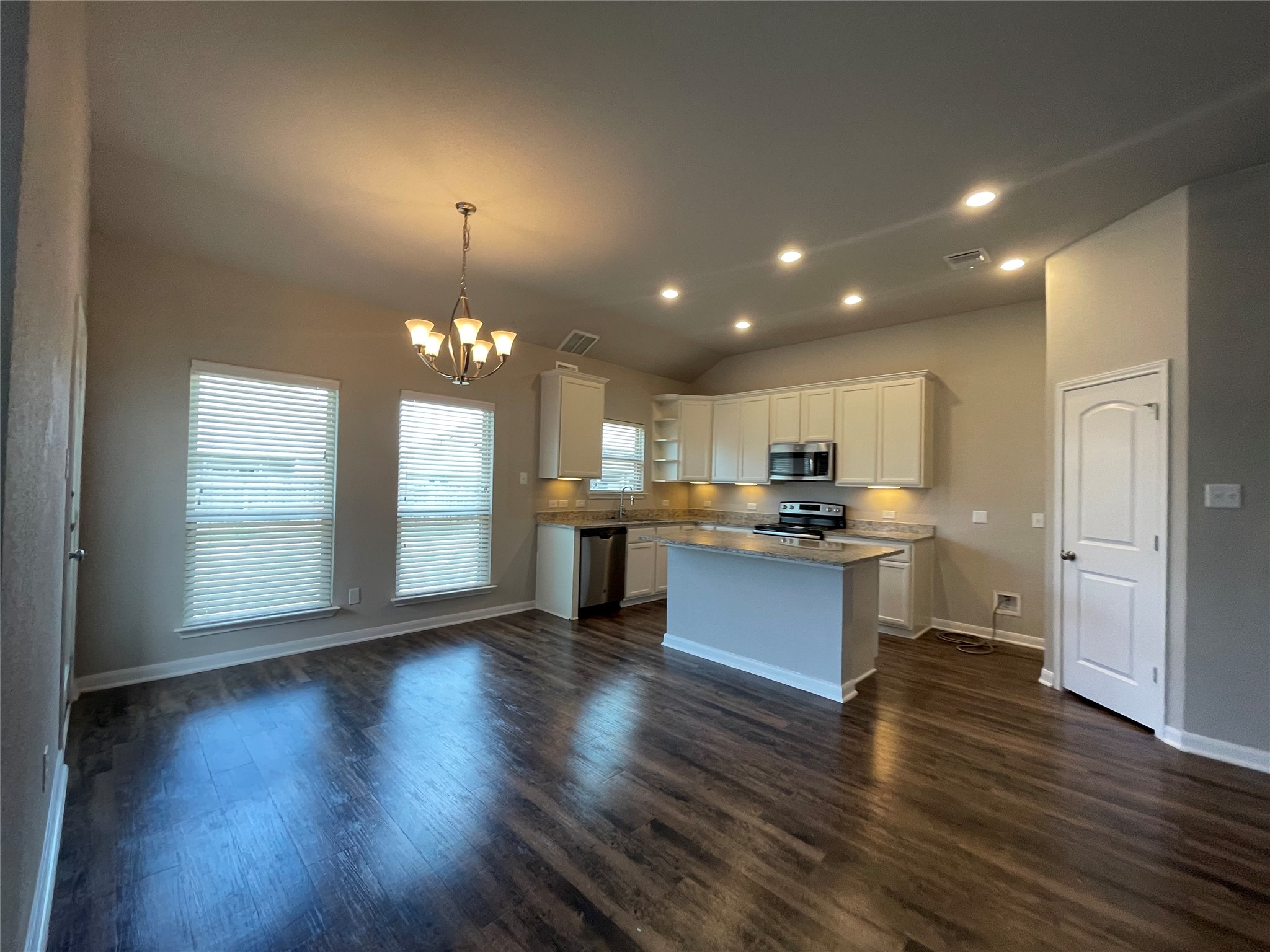 8113 Northgate Loop Temple, TX 76502 - Photo 7 of 35 Open-concept kitchen and dining area featuring wood-finish flooring, recessed lighting, and a neutral color palette