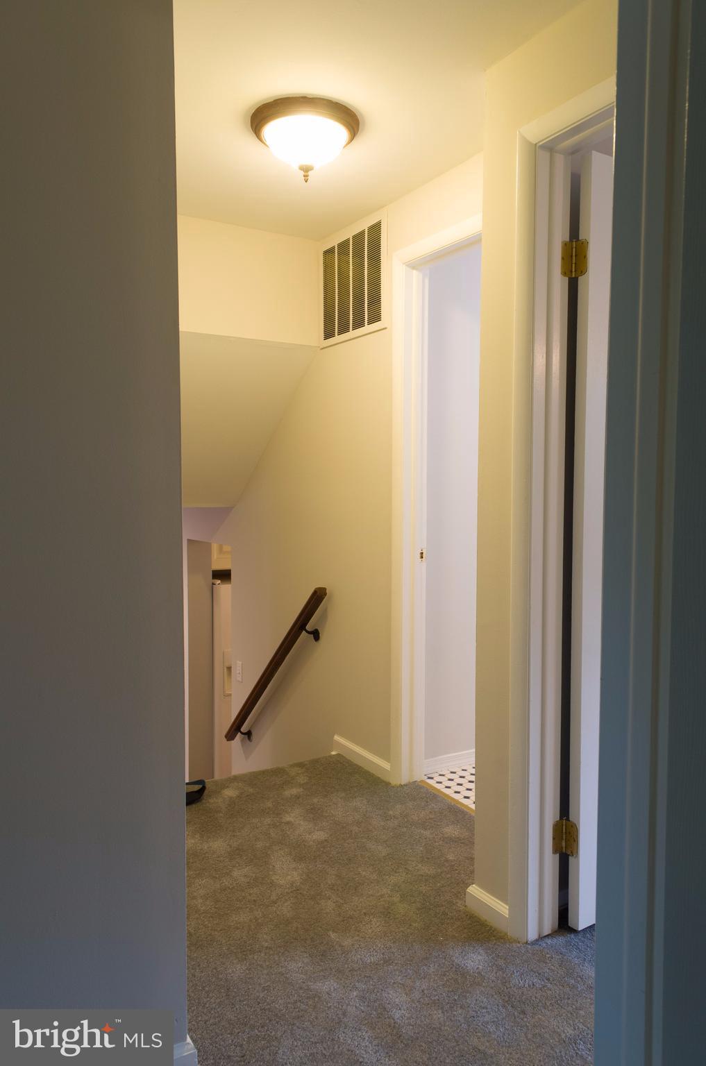 19117 Staleybridge Road Germantown, MD 20876 - Photo 8 of 19 a view of a hallway to rooms