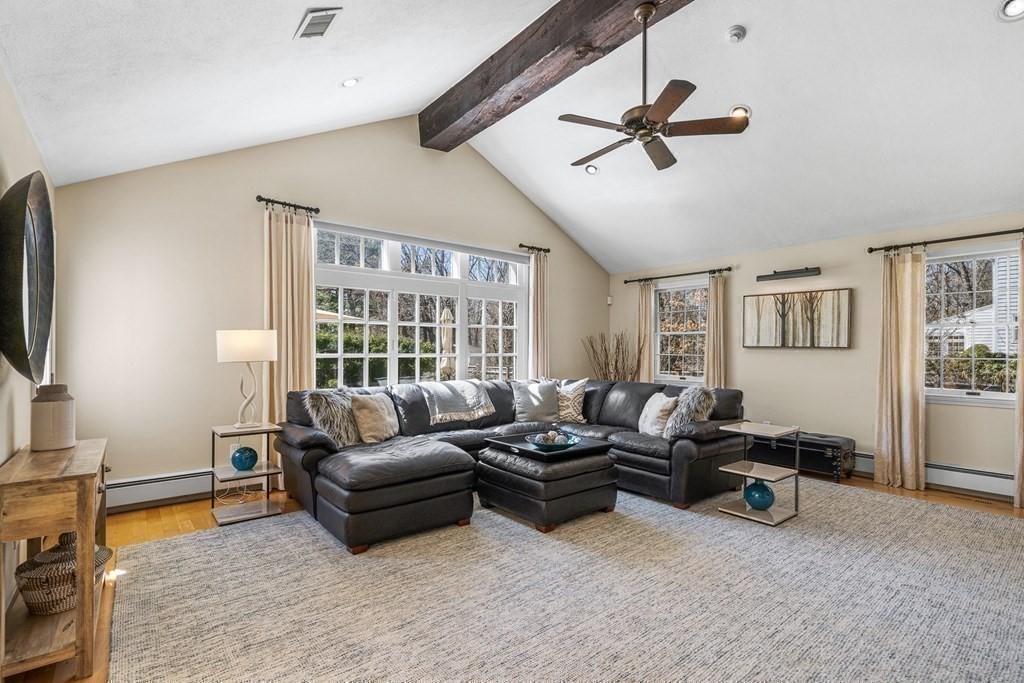 75 Thornberry Road Winchester, MA 01890 - Photo 14 of 41 a living room with furniture gym equipment and a flat screen tv