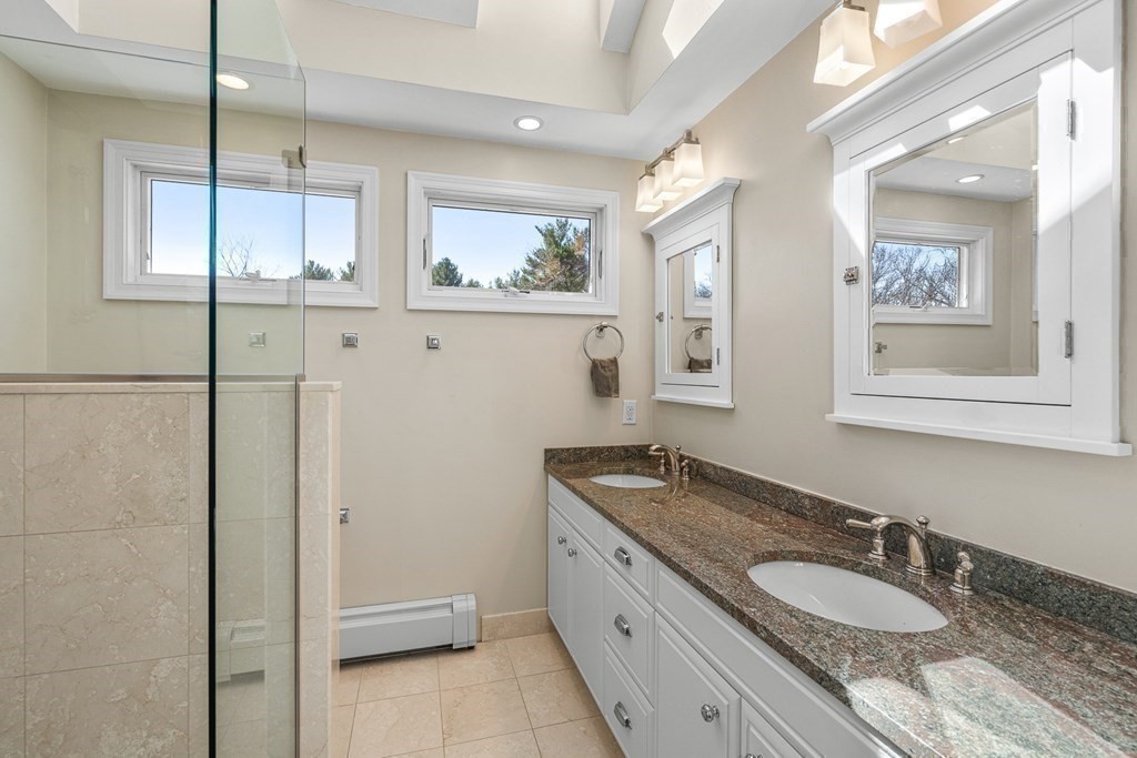 75 Thornberry Road Winchester, MA 01890 - Photo 24 of 41 a bathroom with a granite countertop double vanity sink and a mirror