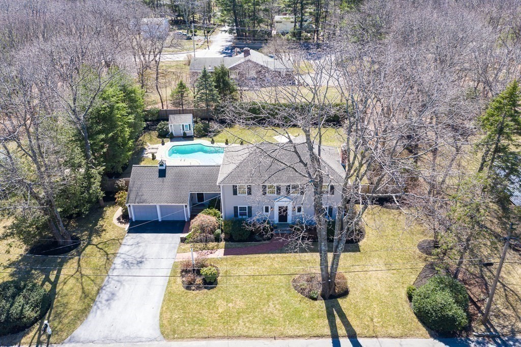 75 Thornberry Road Winchester, MA 01890 - Photo 4 of 41 a front view of a house with swimming pool and porch