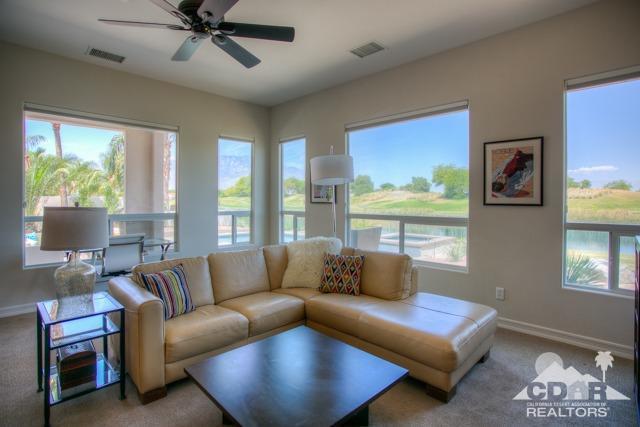 374 Loch Lomond Road Rancho Mirage, CA 92270 - Photo 11 of 38 a living room with furniture and a large window