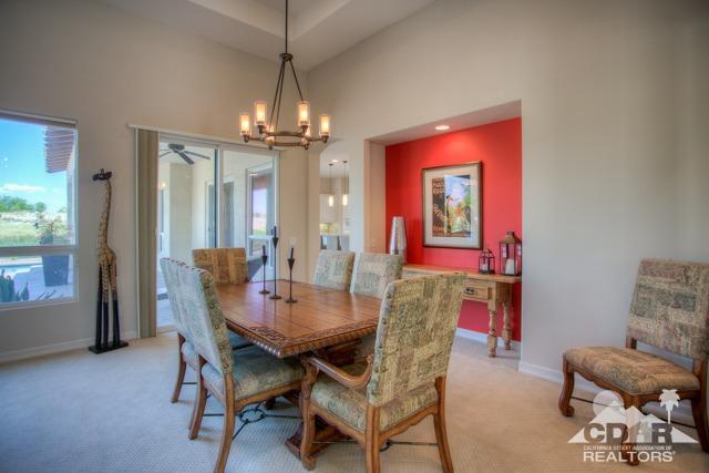 374 Loch Lomond Road Rancho Mirage, CA 92270 - Photo 13 of 38 a view of a dining room with furniture window and outside view
