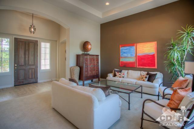 374 Loch Lomond Road Rancho Mirage, CA 92270 - Photo 16 of 38 a living room with furniture a window and a flat screen tv