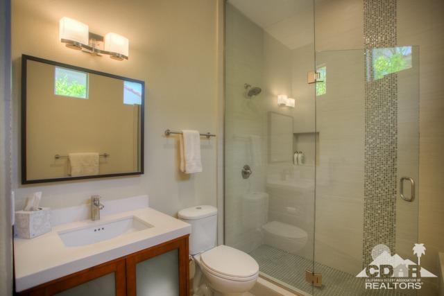 374 Loch Lomond Road Rancho Mirage, CA 92270 - Photo 18 of 38 a bathroom with a sink a toilet and shower