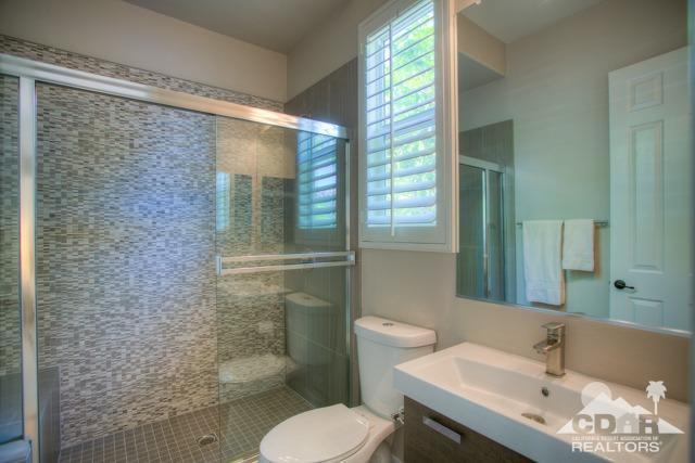 374 Loch Lomond Road Rancho Mirage, CA 92270 - Photo 20 of 38 a bathroom with a sink and a mirror