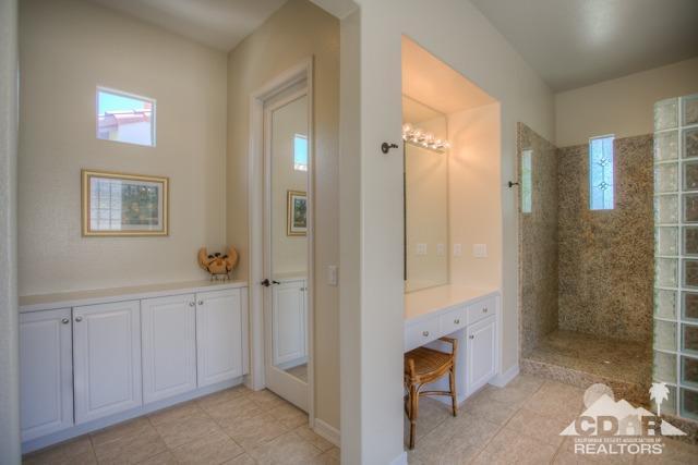 374 Loch Lomond Road Rancho Mirage, CA 92270 - Photo 24 of 38 a view of a bathroom with a bathtub shower sink and mirror
