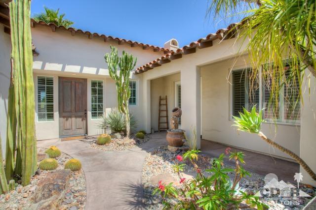 374 Loch Lomond Road Rancho Mirage, CA 92270 - Photo 3 of 38 a front view of a house with a porch