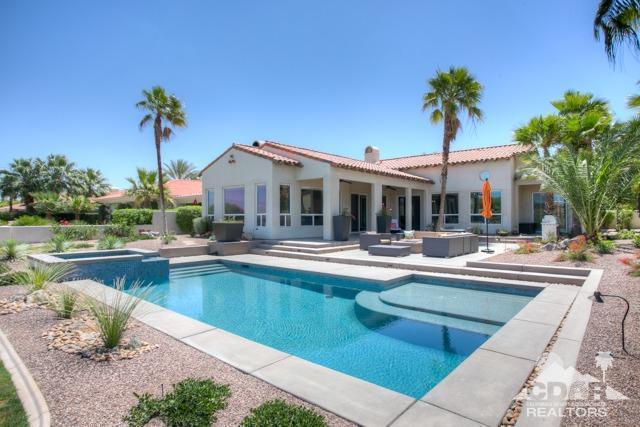 374 Loch Lomond Road Rancho Mirage, CA 92270 - Photo 31 of 38 a view of a house with swimming pool and a chair