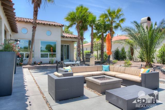 374 Loch Lomond Road Rancho Mirage, CA 92270 - Photo 32 of 38 a view of a patio with couches and a fire pit
