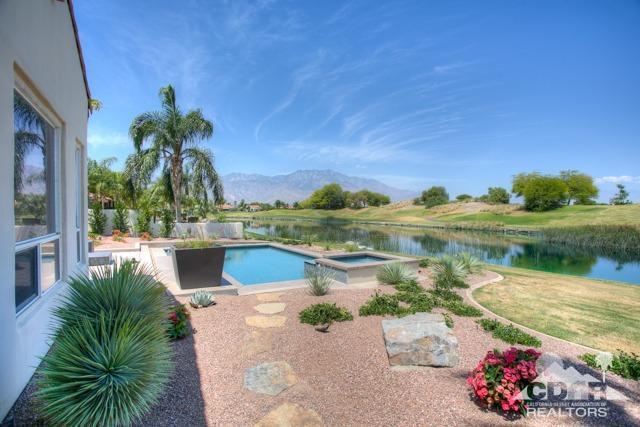 374 Loch Lomond Road Rancho Mirage, CA 92270 - Photo 34 of 38 a view of a lake with a garden