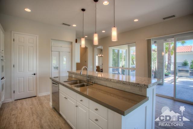 374 Loch Lomond Road Rancho Mirage, CA 92270 - Photo 6 of 38 a bathroom with a sink and a large mirror