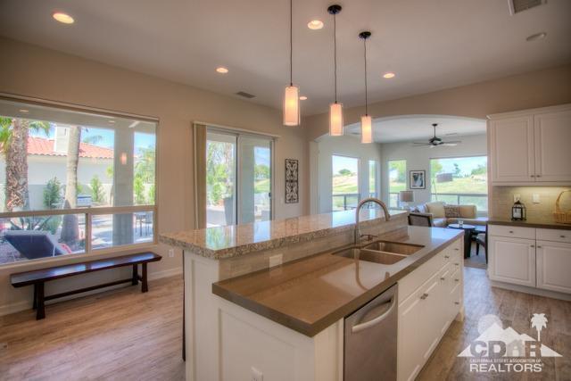 374 Loch Lomond Road Rancho Mirage, CA 92270 - Photo 7 of 38 a kitchen with counter space a sink and appliances